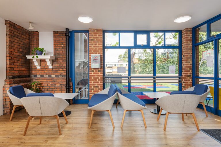 two tables with seating areas around them