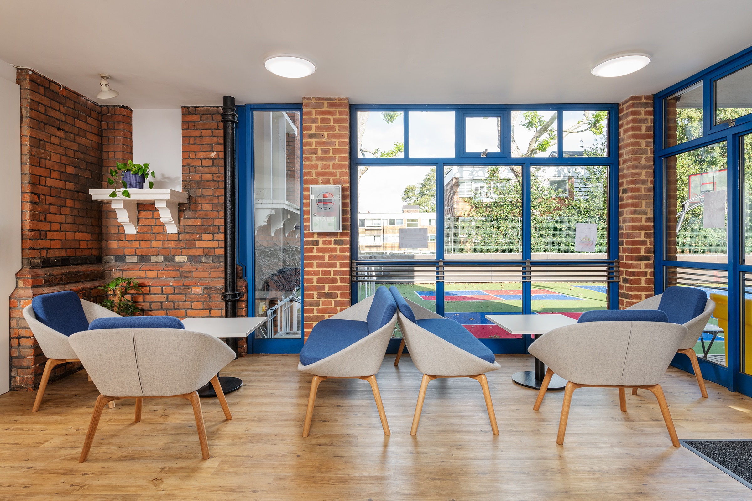 two tables with seating areas around them