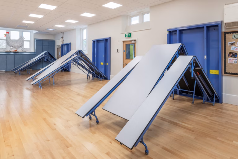 Folding pocket tables in a school hall